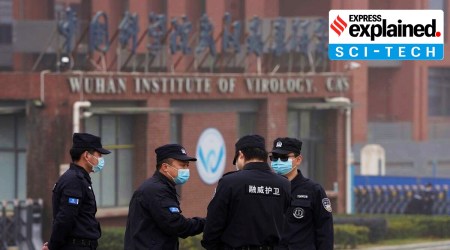 Security personnel gather near the entrance of the Wuhan Institute of Virology.