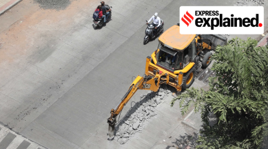 File photo of a JCB cutting a concrete road.