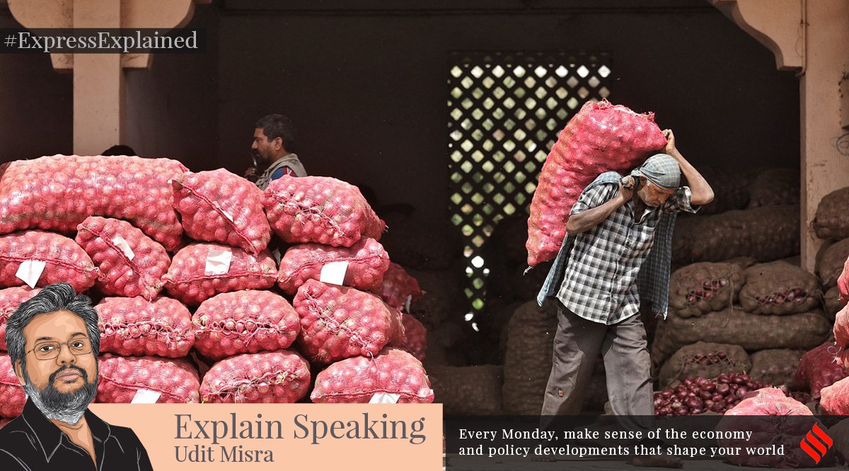 Workers loading onions at APMC wholesale market in Ahmedabad on Wednesday. (Express photo by Nirmal Harindran)