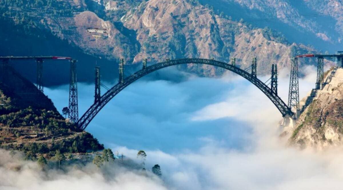 The ‘Chenab Bridge’, hanging with its steel and concrete structure -- half-a-kilometre-long steel arch that defines it -- between Bakkal and Kauri, is 1,178 feet above the riverbed underneath, making it the world’s highest railway bridge. (Twitter/@RailMinIndia)