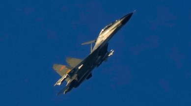 A Chinese J-11 military fighter jet flies above the Taiwan Strait near Pingtan. (AP, file)
