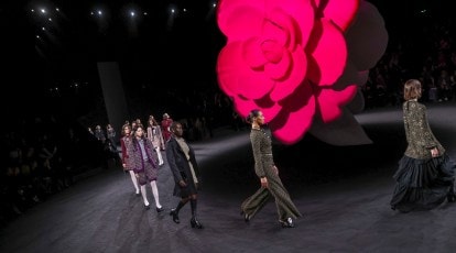 Chanel's camellias, empty chairs close Paris Fashion Week