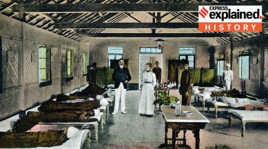 A visual of a care ward with patients on beds, a doctor and a nurse standing.