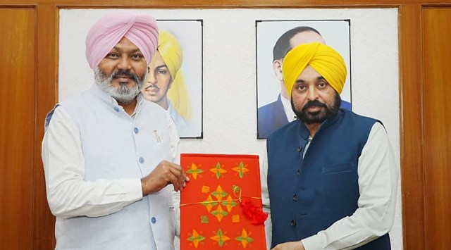 Punjab Chief Minister Bhagwant Mann and Finance Minister Harpal Singh Cheema with Punjab Budget for FY 2023-24 before its presentation in the State Assembly (PTI)