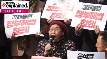 Yang Geum-deok, a survivor of forced labour under Japan's 1910-1945 colonial occupation, speaks during a protest at the National Assembly in Seoul, South Korea, March 7, 2023. The banners read "Yoon Suk Yoel's humiliating diplomacy is OUT!" and “withdraw government solution for victims of forced labour under Japan's 1910-1945 colonial occupation”.