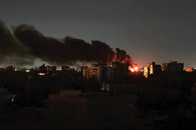 Fire burns after a strike in Khartoum