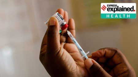 : A nurse fills a syringe with malaria vaccine before administering it to an infant at the Lumumba hospital in Kisumu