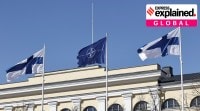 The NATO flag, (centre) and Finland flags flutter over the Foreign Ministry building in Helsinki