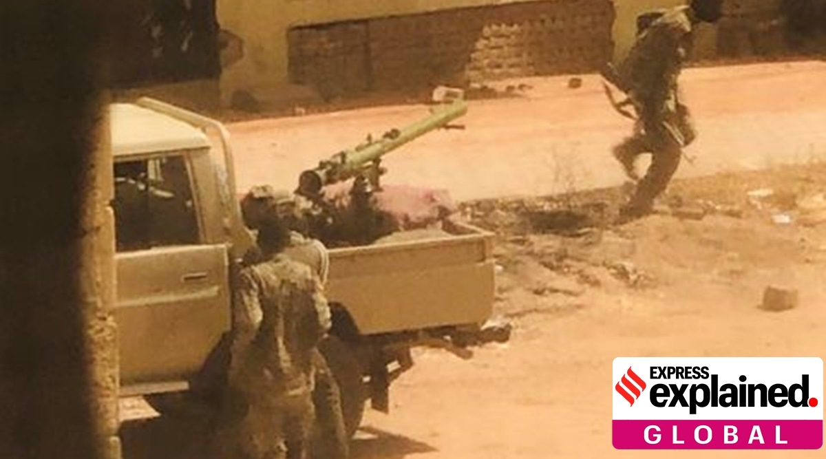 A military vehicle and soldiers said to be from the Sudanese armed forces are seen on a street in Khartoum, Sudan, April 15, 2023 in this picture screen grab obtained from a social media video.
