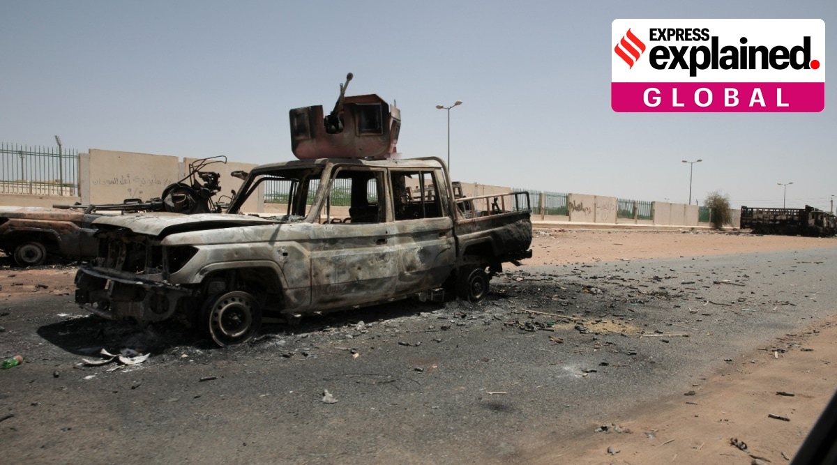 a burned car on a highway.