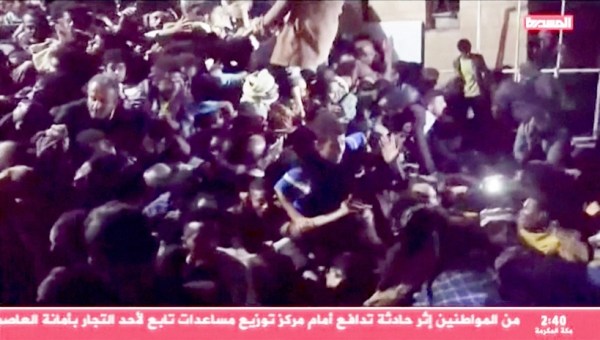 People trapped in the crowd attempt to free themselves during a stampede in Sanaa, Yemen, April 19, 2023, in this still image taken from video. (Al Masirah TV/via Reuters TV/Handout via Reuters)