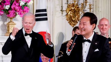 US President Joe Biden reacts as South Korea's President Yoon Suk Yeol sings at an official State Dinner, during Yoon Suk Yeol's visit, at the White House in Washington, US, April 26, 2023.