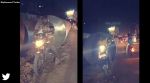 bikers passing through reinforced concrete pipes