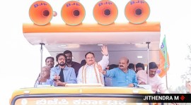 Kannada actor Kichcha Sudeep, BJP chief JP Nadda and Chief Minister Basavaraj Bommai during a roadshow in Shiggaon on April 19, 2023. (Express photo by M Jithendra)