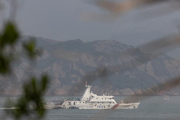 A Chinese coastguard ship sails during a military drill near Fuzhou, Fujian Province, near the Taiwan-controlled Matsu Islands