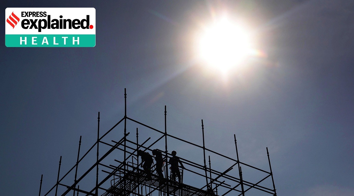 Workers work at the Metro Construction site in Chembur Naka in Mumbai under the unrelenting heat, in late February, 2023.