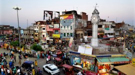 Commuters walk and drive past city's main circle, in Ayodhya, March 28, 2023. (AP)