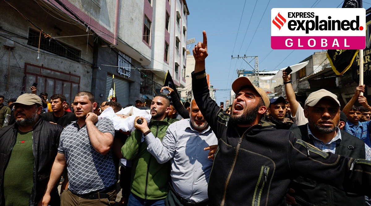 Mourners carry the body of senior Palestinian Islamic Jihad commander Khalil Al-Bahtini, who was killed in an Israeli strike, during his funeral in Gaza City, May 9, 2023.