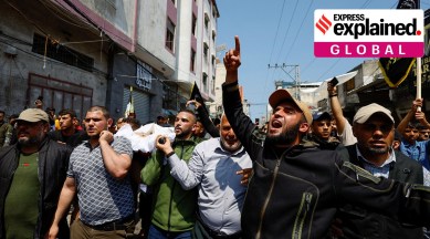 Mourners carry the body of senior Palestinian Islamic Jihad commander Khalil Al-Bahtini, who was killed in an Israeli strike, during his funeral in Gaza City, May 9, 2023.