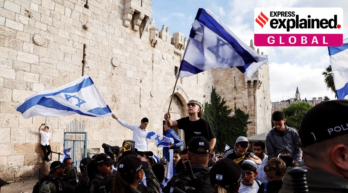 Israel security personel stand by as Israelis gather at Damascus gate to Jerusalem's Old city marking Jerusalem Day, in Jerusalem.