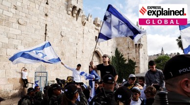 Israel security personel stand by as Israelis gather at Damascus gate to Jerusalem's Old city marking Jerusalem Day, in Jerusalem.
