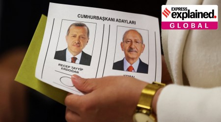 A person holds a ballot with pictures of Turkish President Tayyip Erdogan and presidential candidate of Turkey's main opposition alliance Kemal Kilicdaroglu at a polling station in Istanbul, Turkey May 28, 2023.
