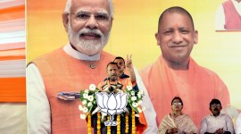 UP local body polls, BJP goes full throttle in Varanasi, PM Modi, Yogi Adityanath, BJP's nagar vikas sankalp patra, voter outreach in UP, indian express, indian express news