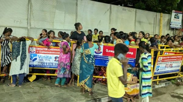 Women outside Chepauk late on Thursday night. Most of these women are getting paid Rs 800 to stand in queue and pass on tickets to black market racketeers. (Photo: Venkata Krishna B/Indian Express)