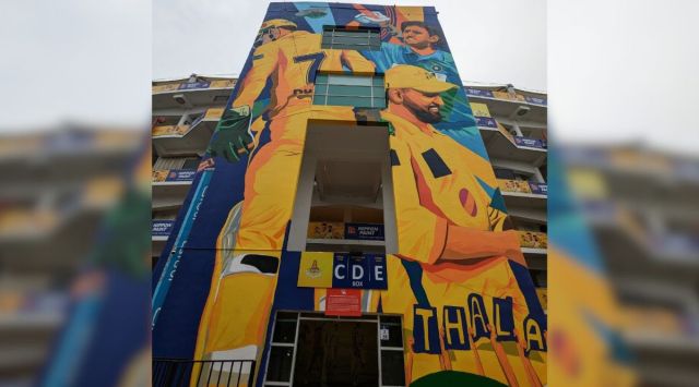 A giant mural of cricket legend MS Dhoni at Chennai Chepauk Stadium.