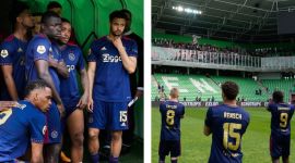 Ajax players stand in the tunnel