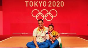 Weightlifter Mirabai Chanu with her coach Vijay Sharma
