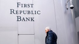A pedestrian walks past a sign at a First Republic Bank in San Francisco on April 26, 2023. (AP)