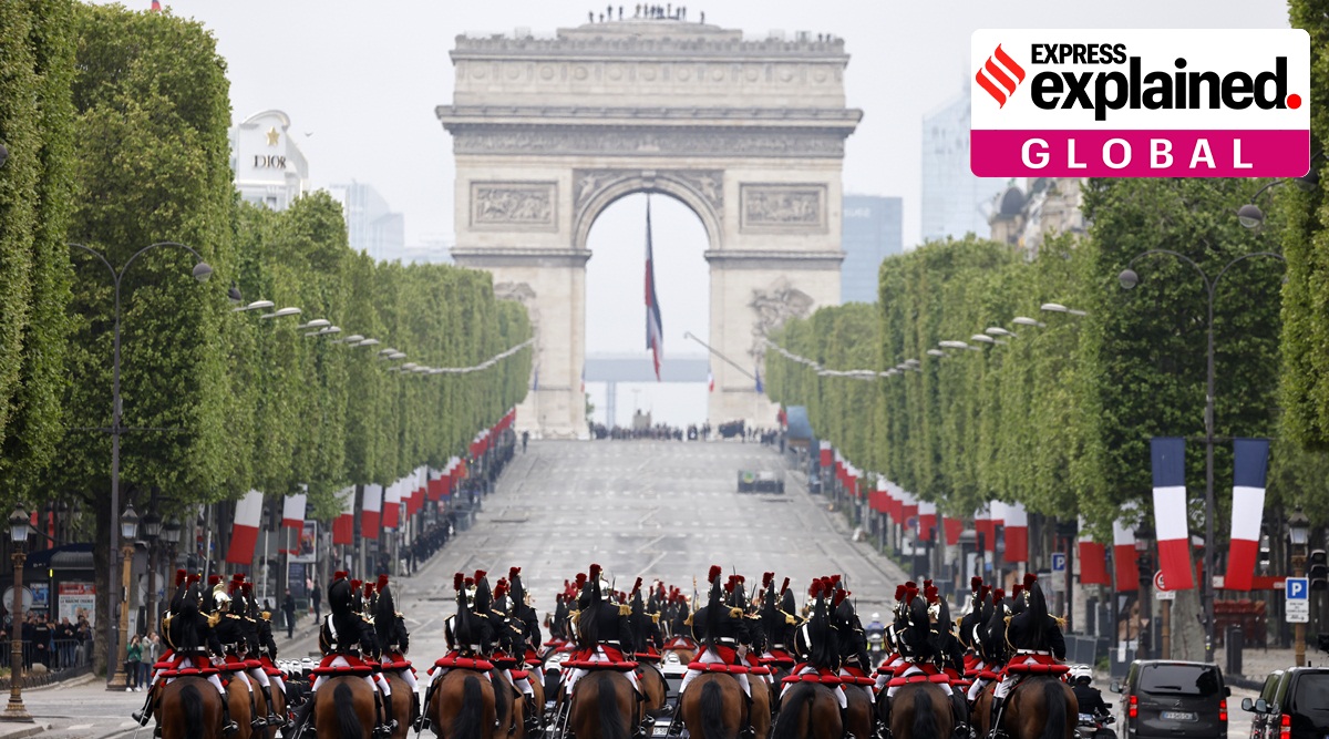 Members of the French Republican Guard ride horses up the Champs-Elysees avenue, with the Arc de Triomphe in background, during ceremonies marking the 78th anniversary of the victory against the Nazis and the end of the World War II in Europe, in Paris, Monday, May 8, 2023.