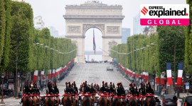 Members of the French Republican Guard ride horses up the Champs-Elysees avenue, with the Arc de Triomphe in background, during ceremonies marking the 78th anniversary of the victory against the Nazis and the end of the World War II in Europe, in Paris, Monday, May 8, 2023.