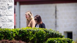 Elizabeth Holmes, the disgraced founder of the blood testing start-up Theranos, turns herself in to custody at the Federal Prison Camp in Bryan, Texas, May 30, 2023. (Annie Mulligan/The New York Times)