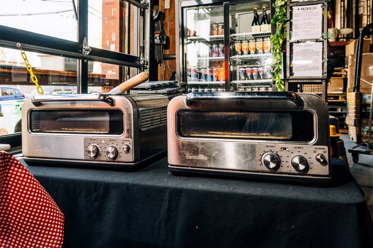 Breville Pizzaiolo ovens are used at a Traze pop-up inside Fifth Hammer Brewing in Queens, April 26, 2023. (DeSean McClinton-Holland/The New York Times)