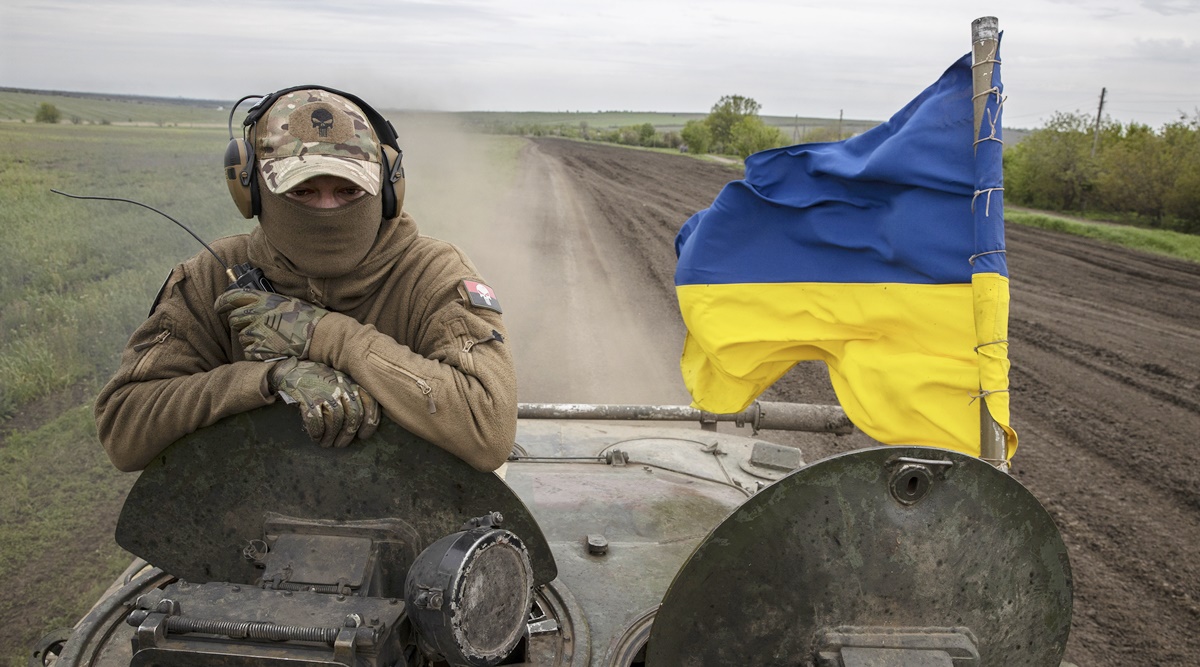 A soldier with Ukraine’s 28th Mechanized Brigade surveys the battlefield from a BMP armored vehicle during fighting near Bakhmut, May 8, 2023