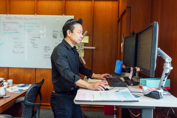 Mayor Ken Sim of Vancouver at his desk in his office at City Hall in Vancouver, B.C., Canada, on March 16, 2023. Sim, Vancouver’s first mayor of Chinese descent, rejects claims of Chinese interference and says his landslide win was due to his tireless campaigning and more appealing policies. (Jackie Dives/The New York Times)