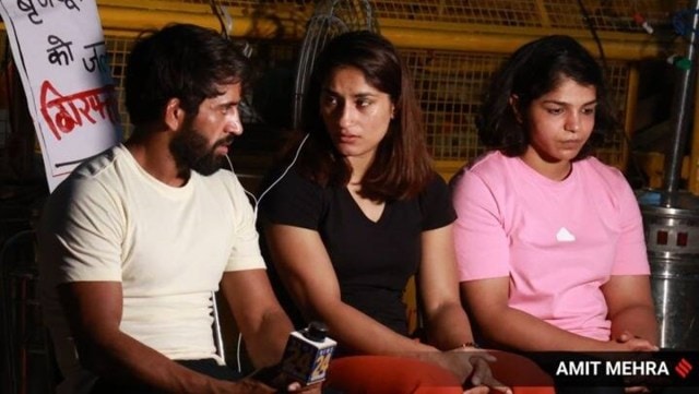 Vinesh Phogat, Sakshi Malik, and Bajrang Punia at wrestlers' protest