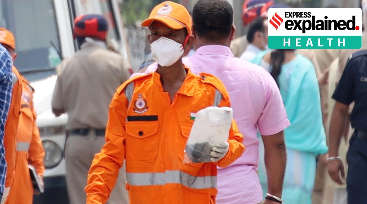 NDRF jawan with the sample collected for investigation, after the poisonous gas leak at Sua road of Giaspura in Ludhiana on Sunday.
