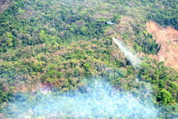 A helicopter works to douse fires at a hilltop in Goa. (Photo via Twitter/@IN_GNA)