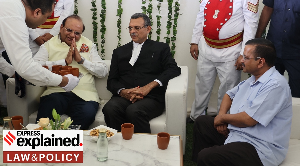 Vinai Kumar Saxena being greeted by Delhi CM Arvind Kejriwal during the formers oath taking ceremony as 22nd Lt Governor of Delhi at Raj Niwas in New Delhi, Thursday, May 26, 2022. (Express Photo By Amit Mehra)