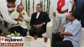 Vinai Kumar Saxena being greeted by Delhi CM Arvind Kejriwal during the formers oath taking ceremony as 22nd Lt Governor of Delhi at Raj Niwas in New Delhi, Thursday, May 26, 2022. (Express Photo By Amit Mehra)