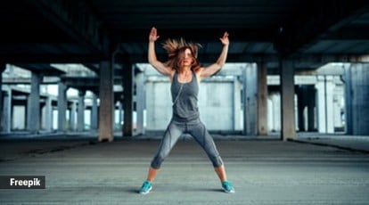 Premium Photo  Fitness jump and portrait of strong woman in