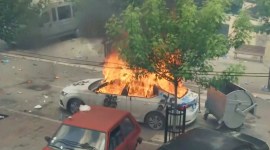 In this grab taken from video, a view of a car set on fire as KFOR soldiers clash with Kosovo Serbs in the town of Zvecan, northern Kosovo, May 29, 2023. (AP)