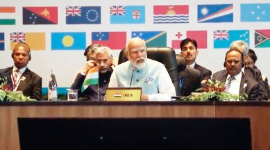 In this image from video, Prime Minister Narendra Modi, center, addresses a meeting with Pacific Island leaders to discuss ways to better cooperate in Port Moresby, Papua New Guinea, May 22, 2023. (Australian Broadcasting Corp. via AP)