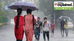 people seen walking under an umbrella.