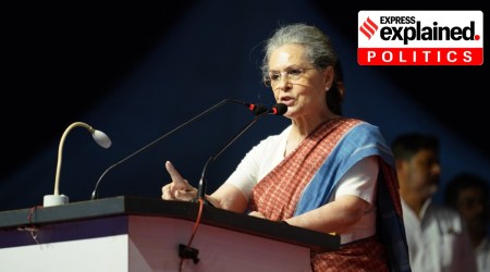 congress leader sonia gandhi speaking on a podium mic.