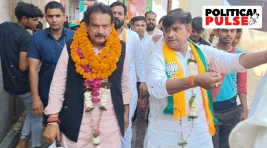 Minister of State for Law and Justice Satya Pal Singh Baghel with a BJP worker. (Facebook/SP Singh Bhagel)