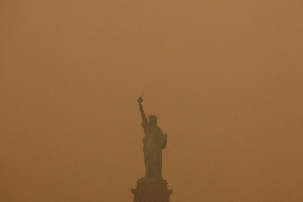 The Statue of Liberty is covered in haze and smoke caused by wildfires in Canada, in New York, U.S., June 6, 2023. 